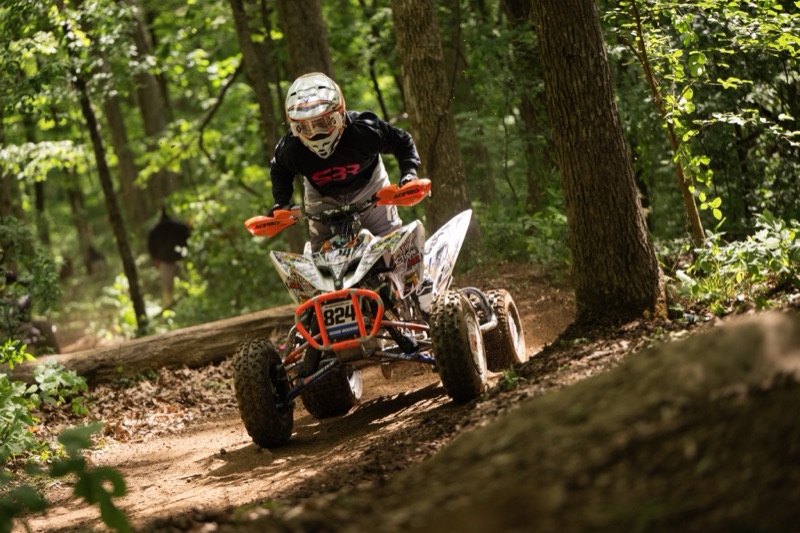 Bryson Dickerson cornering through forest trail