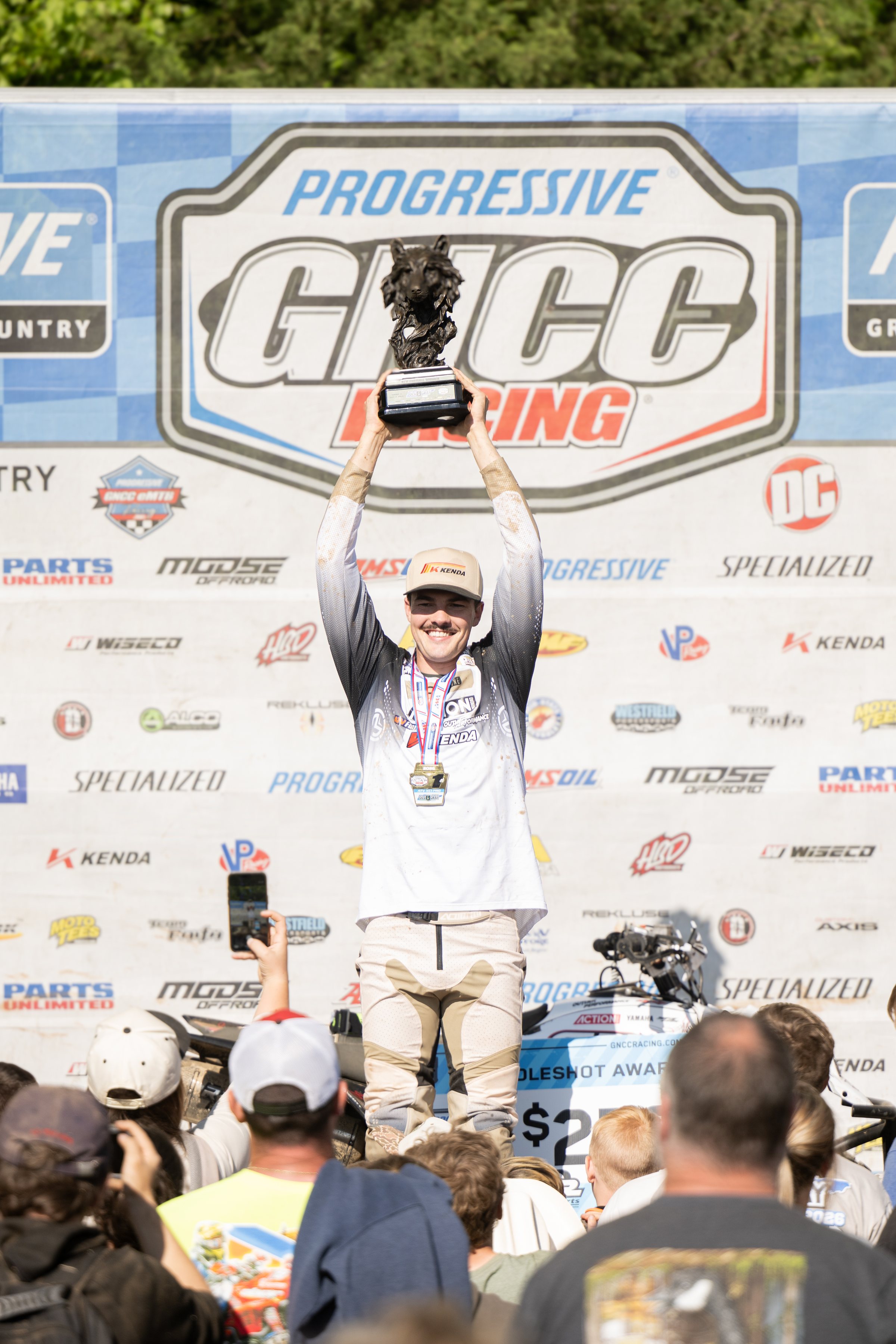 Wyatt Wilkin hoisting the GNCC trophy